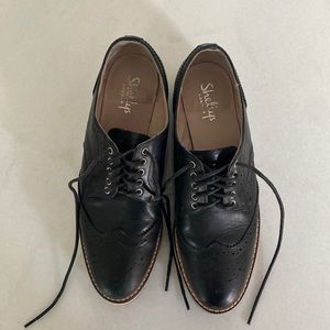 Black lace up Oxfords by Shellys London with slight platform